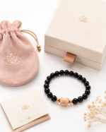 Obsidian Protection Bracelet flatlay with AVENSU pouch gift box and card