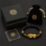 Black obsidian Pixiu bracelet with black gift box pouch and gold feng shui details