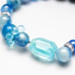 AVENSU blue crystal bracelet with faceted aqua centerpiece and polished gemstone beads