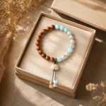 Blue Gemstone and Wood Lotus Bracelet in Open Gift Box