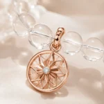Close-up of clear quartz clarity and focus bracelet with rose gold star charm