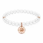 Clear quartz clarity and focus bracelet with rose gold star charm on white background