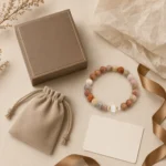 Mixed jasper grounding and balance bracelet with taupe gift box pouch card and ribbon