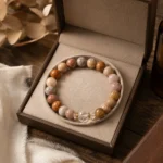 Mixed jasper grounding and balance bracelet with multicolor natural stone beads displayed in an open gift box