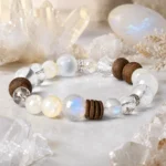 Mixed stone wood and crystal bead bracelet displayed among clear quartz crystals