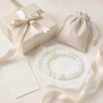 Pale green and white stone bead bracelet with gift box pouch ribbon and message card