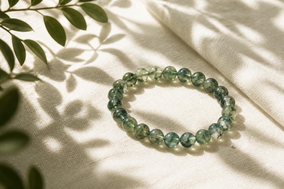 Moss agate green translucent bead bracelet with cream fabric and leaf shadows