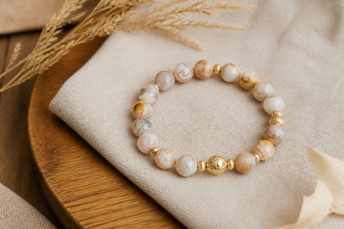 Crazy lace agate bracelet on sand linen and warm wood