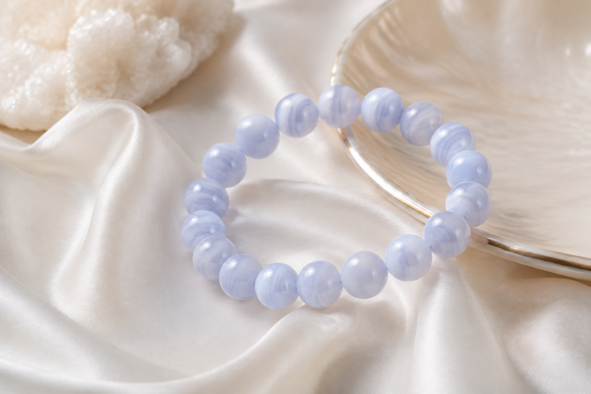 Blue lace agate pale blue striped bead bracelet on ivory silk with a pearl-toned dish